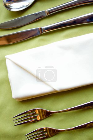 Photo for Table setting with cutlery on white plate. - Royalty Free Image