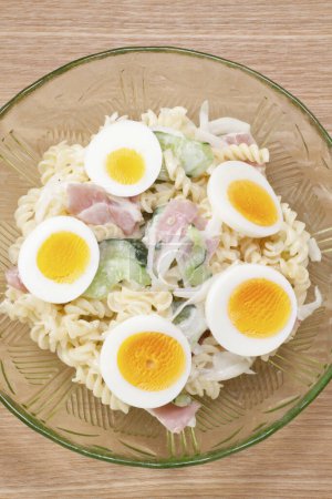 Photo for Salad with boiled eggs and pasta on background, close up - Royalty Free Image