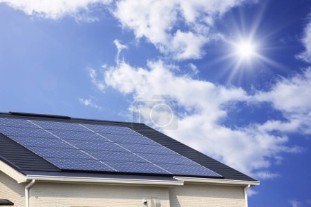 Photo for Solar energy panels on roof against cloudy sky - Royalty Free Image