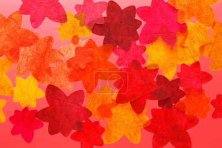 Colorful autumnally background with papercut autumn leaves 