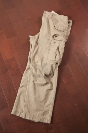Photo for Brown casual pants on table background - Royalty Free Image