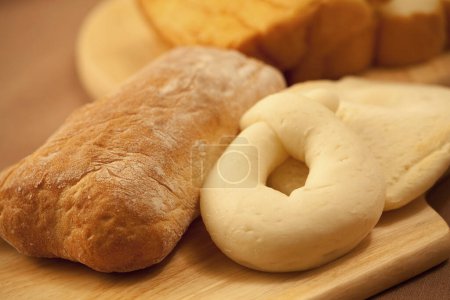 Photo for Sliced fresh bread on a table on background, close up - Royalty Free Image