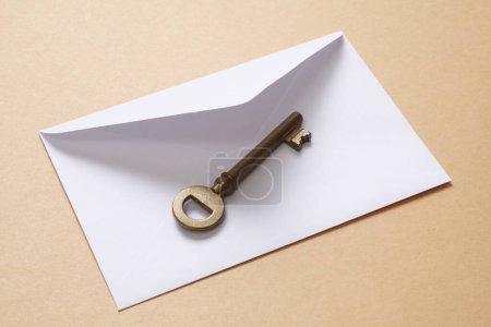 Photo for Metal key and envelope on white background - Royalty Free Image