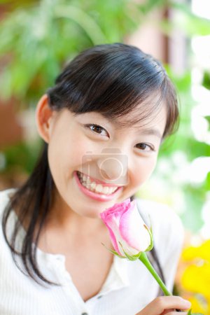 Photo for Portrait of young Japanese woman florist with flower - Royalty Free Image