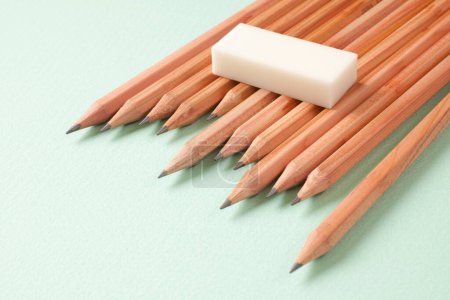 Photo for Wooden pencils on a green background. top view - Royalty Free Image
