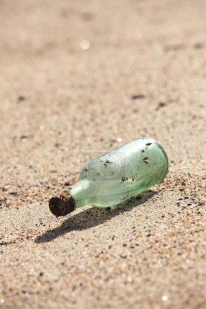 Photo for Bottle with the beach in the sand - Royalty Free Image