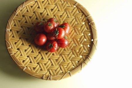 Photo for Red tomatoes on it on a table on background, close up - Royalty Free Image