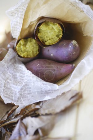 Photo for Japanese roasted sweet potatoes in paper - Royalty Free Image