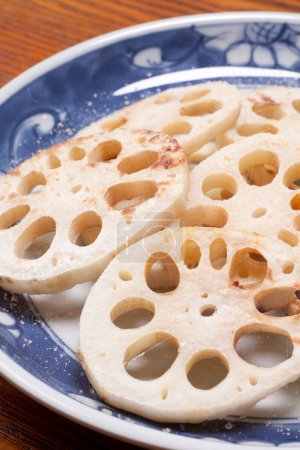 fresh raw lotus root slices on background
