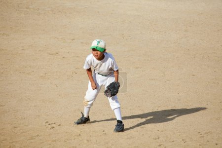 Photo for Japanese boy pitcher playing baseball, Little League concept - Royalty Free Image