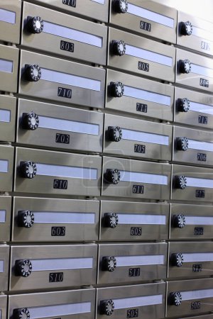 Photo for Metal mailboxes on the wall of the house. - Royalty Free Image