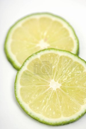 Photo for Sliced lime isolated on white background - Royalty Free Image