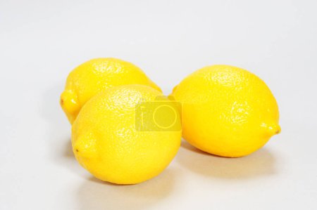 Photo for Pile of fresh lemons isolated on white background - Royalty Free Image
