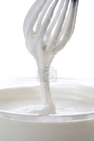 Photo for Whisk with cream close up view - Royalty Free Image