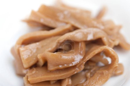 Menma. bamboo shoots boiled, sliced, fermented, dried or preserved in salt, then soaked in hot water and sea salt.