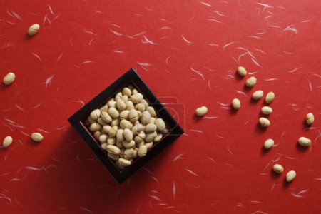 Photo for Beans for mame-maki (bean-throwing) on table. Image of Setsubun, japanese traditional event - Royalty Free Image