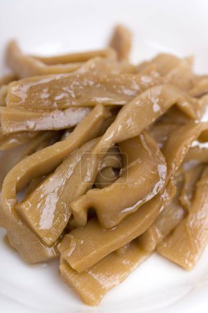 Photo for Menma. bamboo shoots boiled, sliced, fermented, dried or preserved in salt, then soaked in hot water and sea salt. - Royalty Free Image