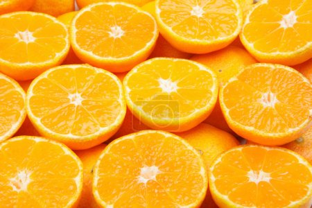 Téléchargez les photos : De nombreux fruits frais orange comme fond, vue de dessus - en image libre de droit