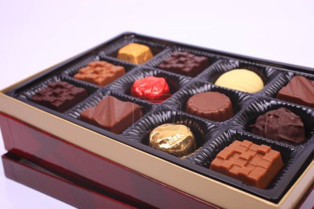 Photo for Box of delicious various sweets on light background - Royalty Free Image