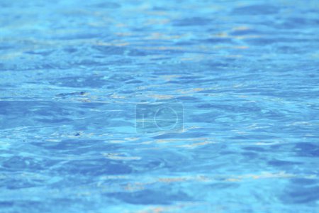 Photo for Blue swimming pool water with ripples and reflection - Royalty Free Image