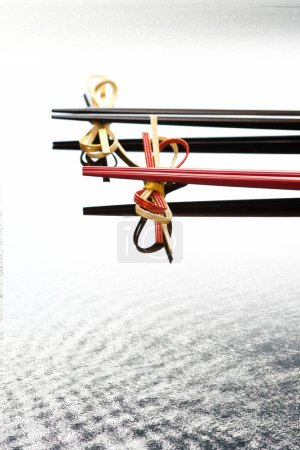 Close up view of chopsticks placed on bows