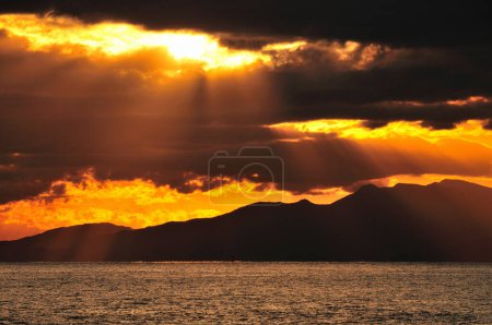 Photo for Beautiful sunset over the sea coast with scenic hills - Royalty Free Image