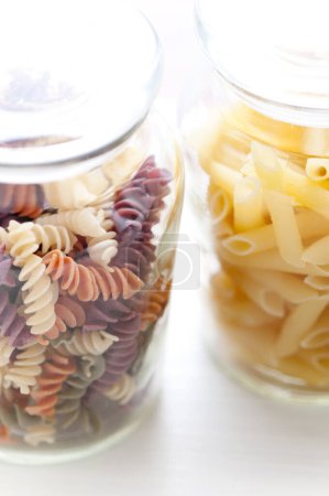 Photo for Raw assorted pasta in glass jars - Royalty Free Image