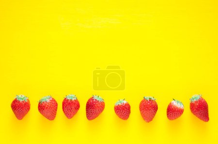 Photo for Fresh strawberries close up isolated on yellow - Royalty Free Image