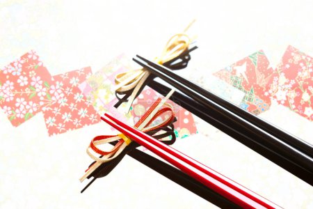 Photo for Close up view of chopsticks placed on bows - Royalty Free Image