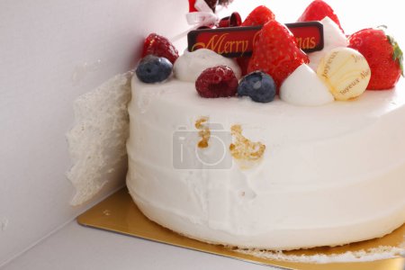Photo for Delicious cake with cream and fruits in white box - Royalty Free Image