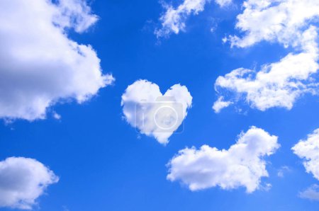 Photo for Blue sky background with white clouds and heart-shaped cloud - Royalty Free Image