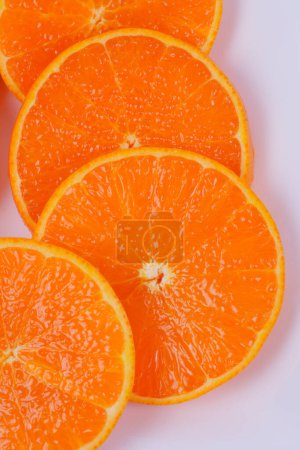 Photo for Plate of sliced oranges isolated on white background - Royalty Free Image