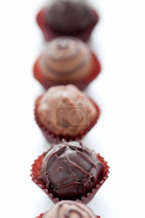 Photo for Delicious  chocolate candies  on background, close up - Royalty Free Image