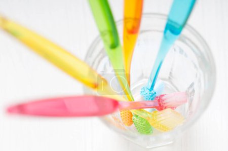 Photo for Colorful dental brushes on a white background. - Royalty Free Image
