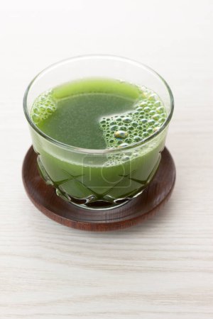 Photo for Close-up view of glass of green fresh healthy organic drink on light background - Royalty Free Image