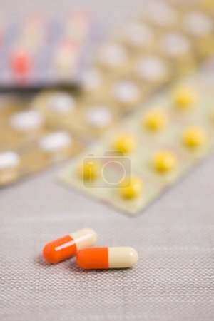 Photo for Medical pills with capsules on background, close up - Royalty Free Image