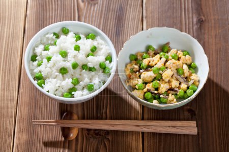 Photo for Rice and fried chicken with peas close up - Royalty Free Image