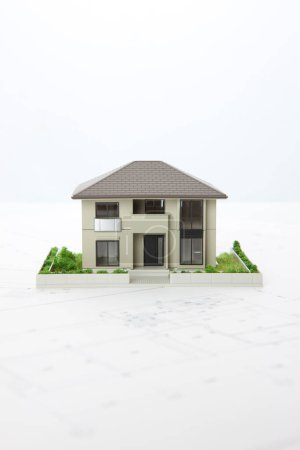 Téléchargez les photos : Petit modèle de maison sur fond blanc, concept hypothécaire - en image libre de droit