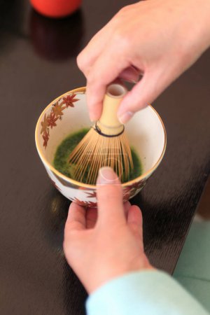 Photo for Woman making tea, Outdoor Tea Ceremony concept - Royalty Free Image