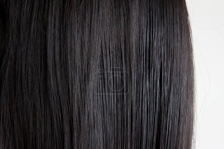 Photo for Brunette or black hair. Female long dark hair in black. Beautifully laid curls - Royalty Free Image