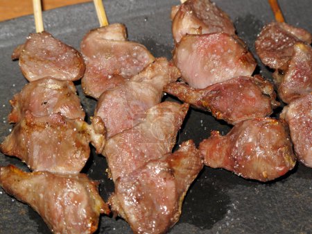 Photo for Grilled meat on skewers, close up view - Royalty Free Image