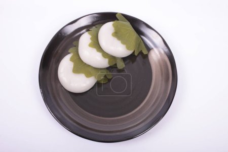 Photo for Tasty Japanese sweets kashiwamochi on background, close up - Royalty Free Image