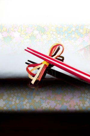 Photo for Close up view of chopsticks placed on bow - Royalty Free Image