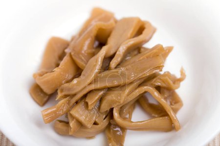 tasty Menma. bamboo shoots boiled, sliced, fermented, dried or preserved in salt, then soaked in hot water and sea salt.