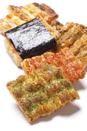 close-up view of traditional japanese senbei rice crackers on white background                                       