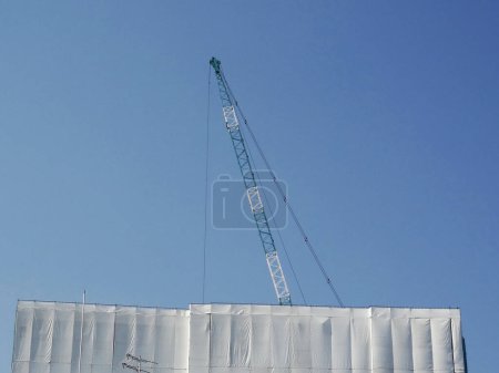 Photo for Crane and a large building - Royalty Free Image