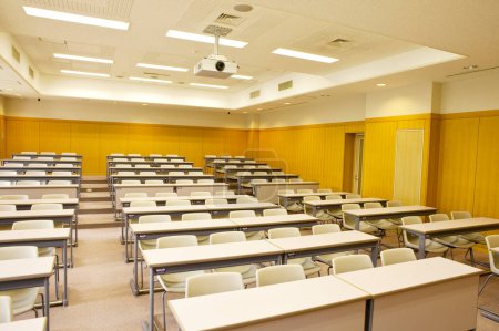 Photo for Interior of empty classroom in school. Rows of wooden desks and chairs - Royalty Free Image