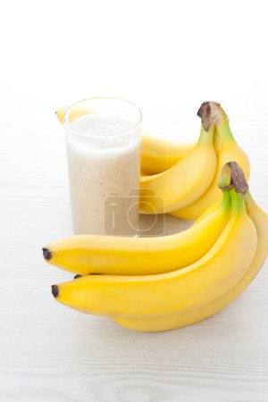 Photo for Milkshake with banana, healthy breakfast - Royalty Free Image