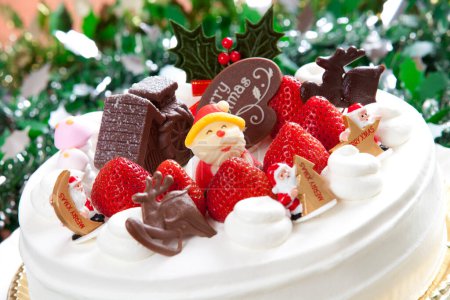 Photo for Delicious chocolate cake with christmas decorations and strawberries - Royalty Free Image