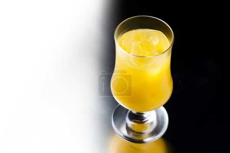 Photo for Fresh orange smoothie in a glass. on a white background - Royalty Free Image